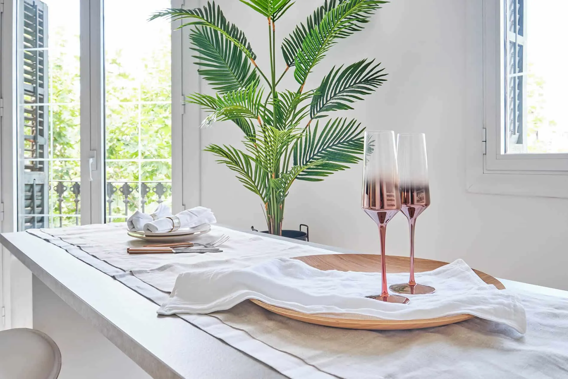 Barcelona apartment - first floor, kitchen island with two wine glasses, designed by Beatrice Leupold