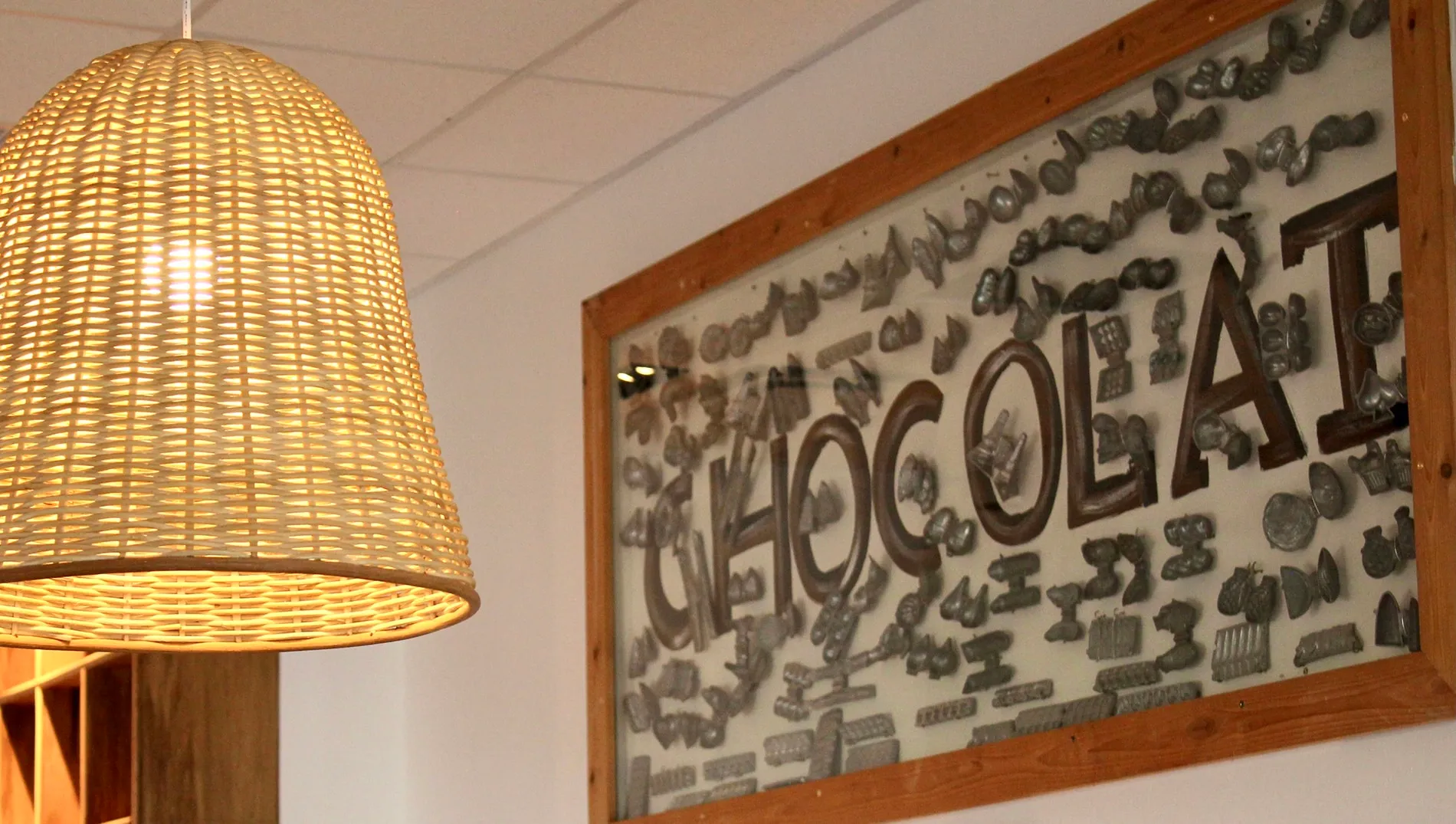Café Crème Miami Restaurant - picture of a frame on the wall with the word chocolate in it, design by Beatrice Leupold