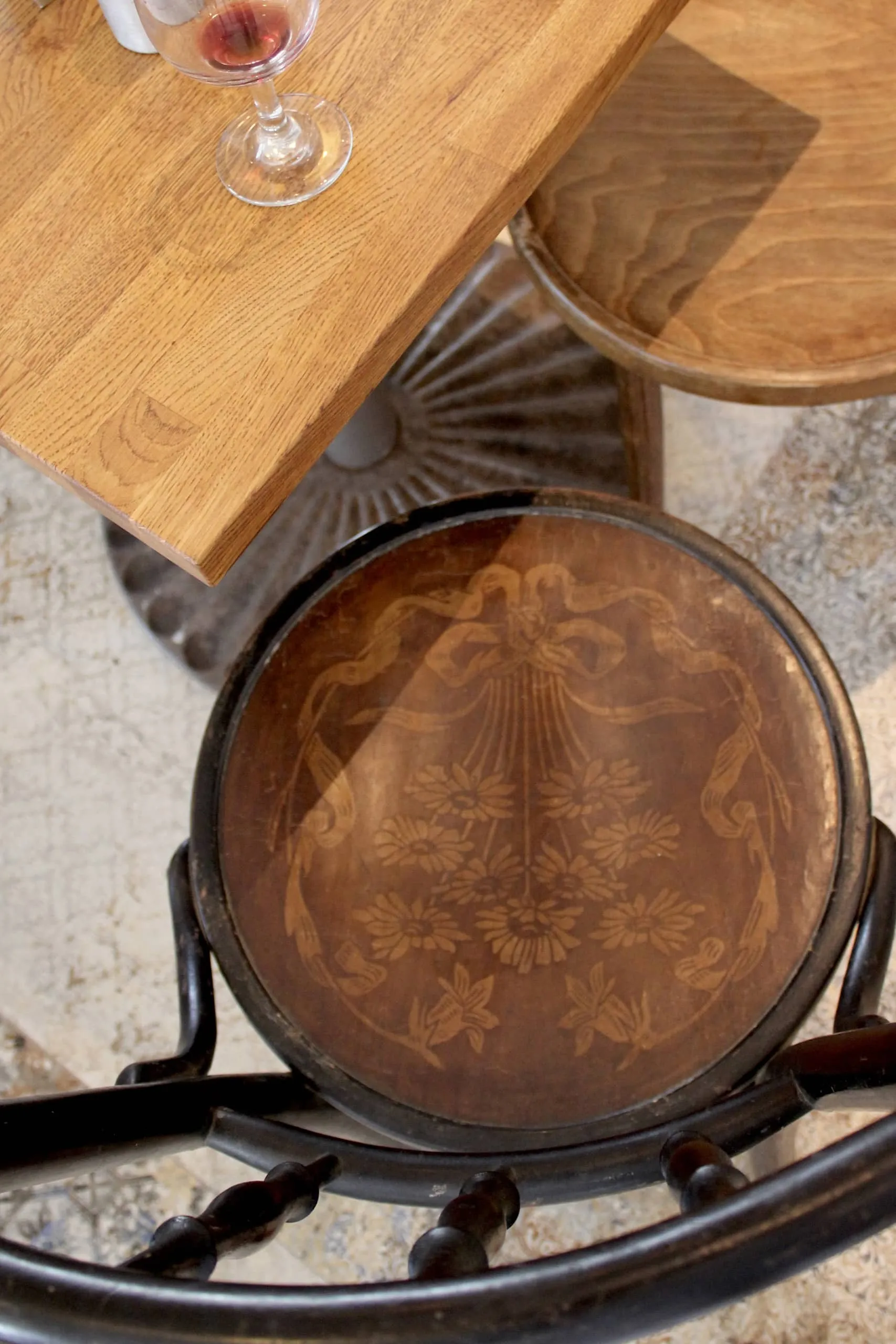 Café Crème Miami Restaurant - wooden chairs with flower engravings, design by Beatrice Leupold