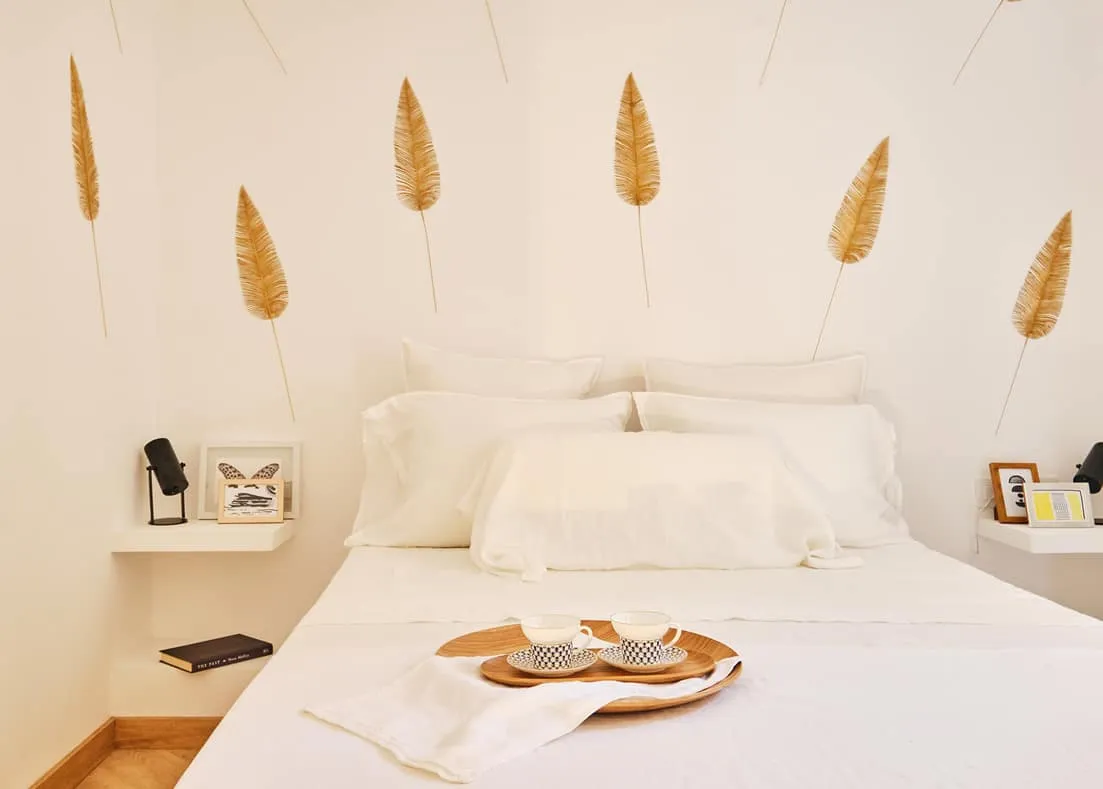 Barcelona apartment - first floor, main bedroom with white bed sheets, designed by Beatrice Leupold