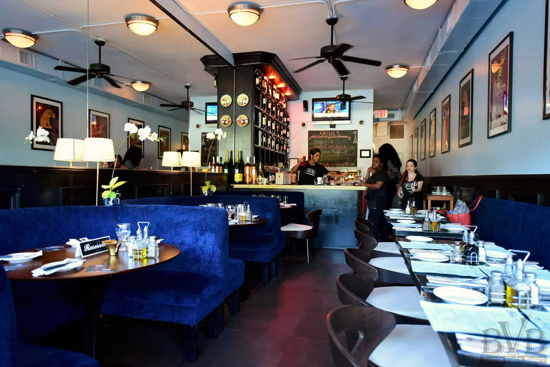 Buena Vista Bistro Restaurant - view of the interior transformation with blue booths on one side and tables on the other, designed by Beatrice Leupold
